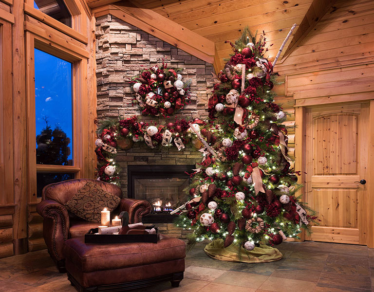 Photograph of a tree and fireplace decorated for Christmas
